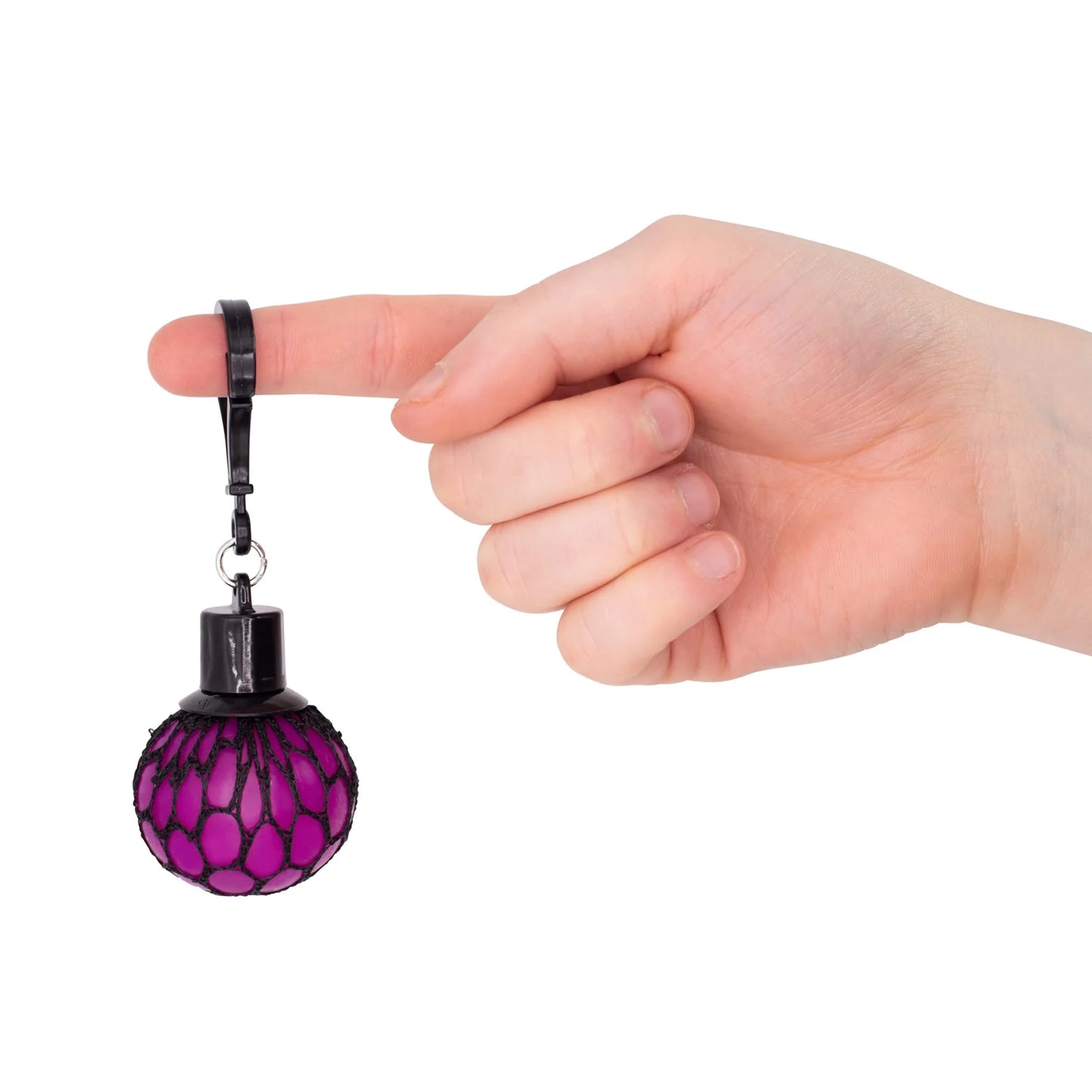 Hand holding a purple and black ball-shaped object with a keychain attached on a white background