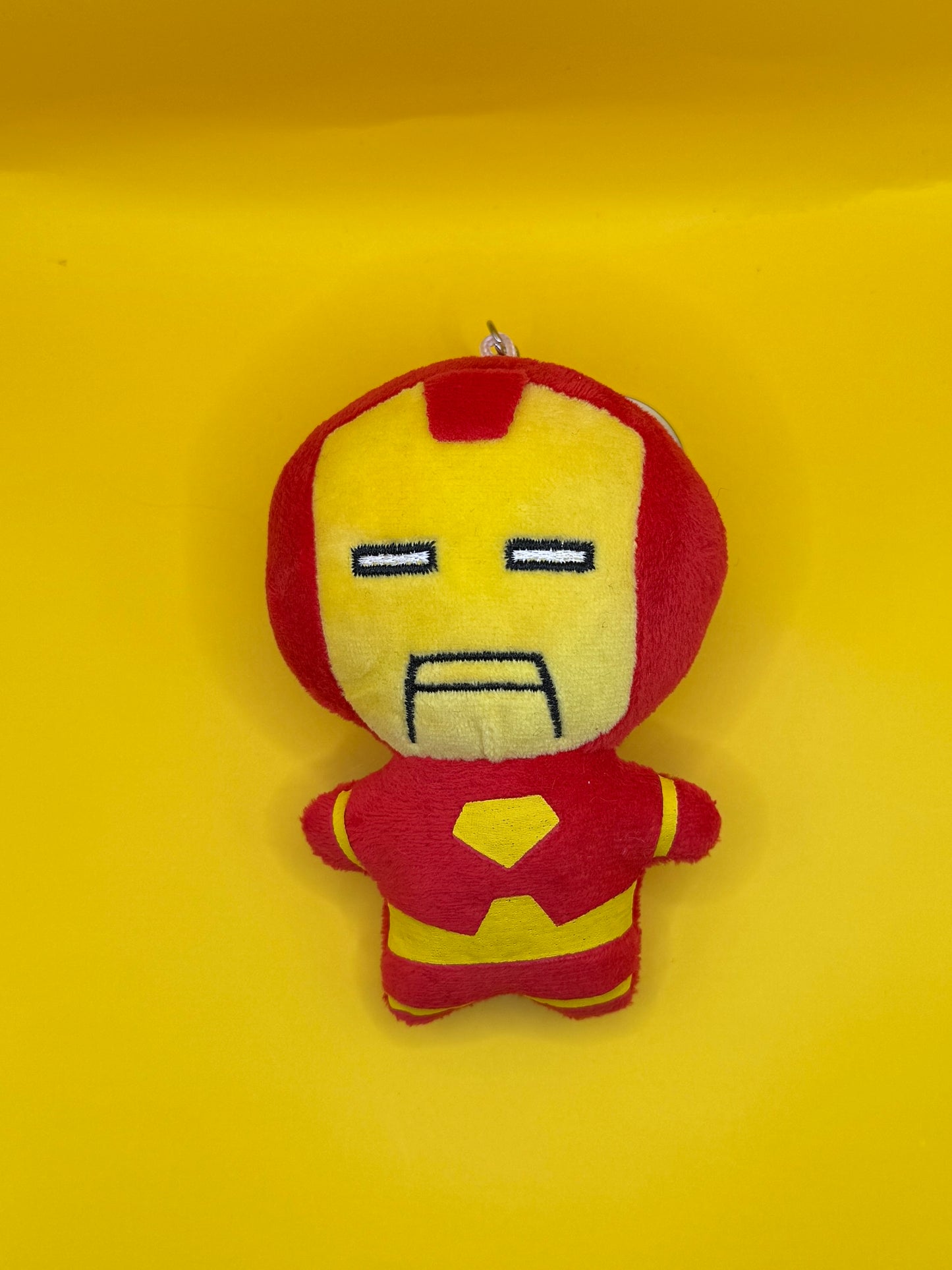 Superhero plush keychain toy in red and yellow

Soft superhero plush keyring on yellow background

Mini superhero plush toy with keyring

Superhero themed plush bag charm